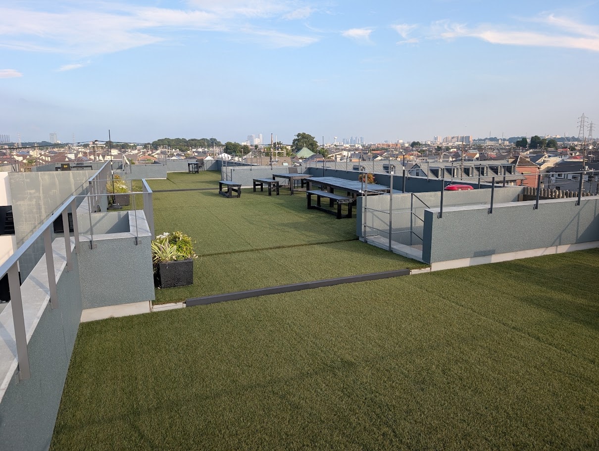 Rooftop terrace with artificial turf and bench